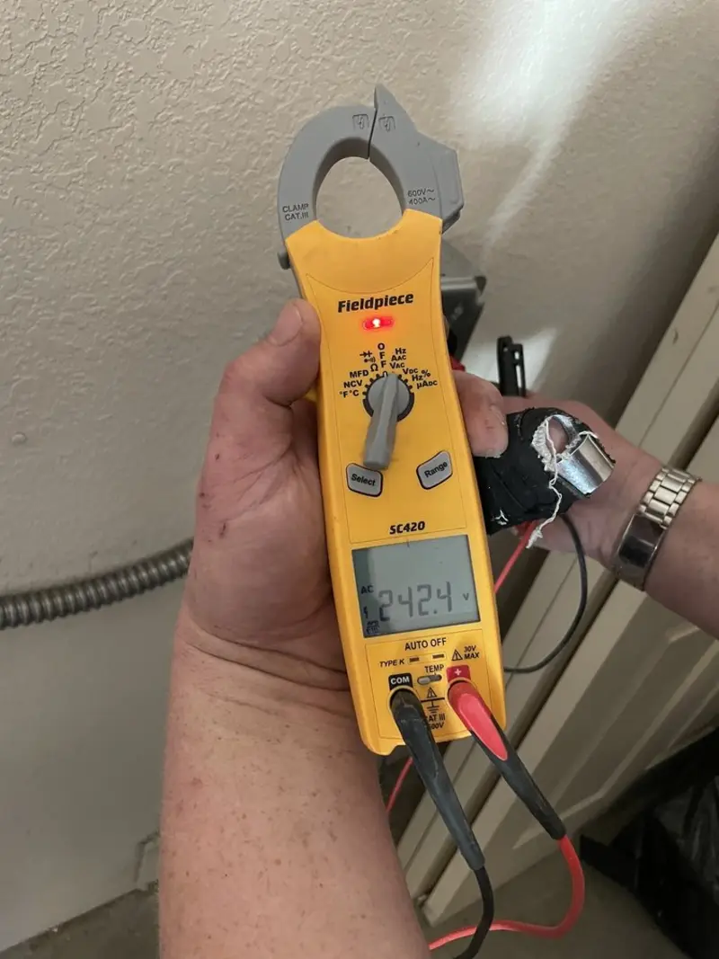 Voltage testing with clamp meter during Aluminum Wiring Replacement in Cedar Springs